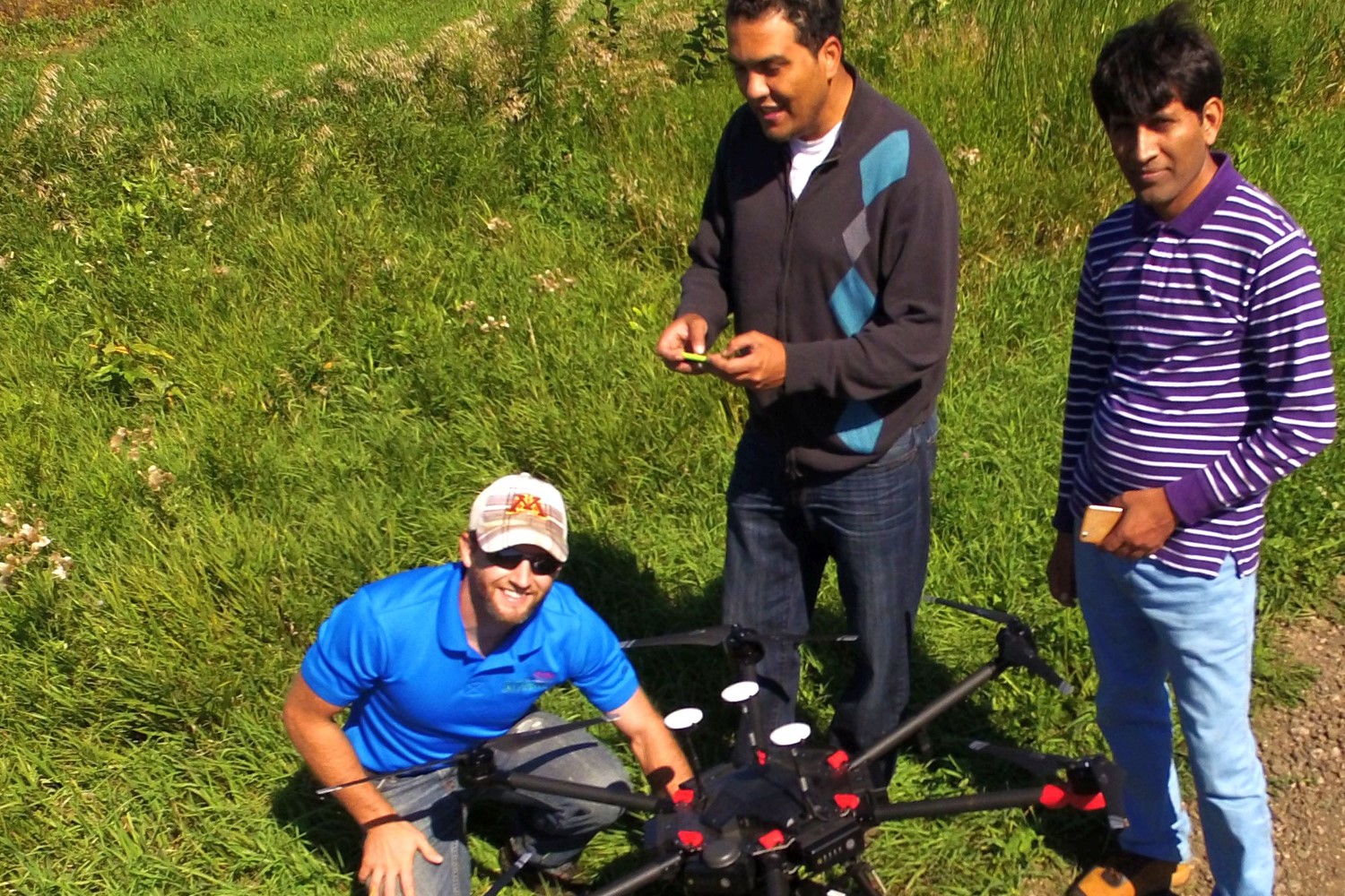Tyler, Aicam, and Muhammad setting up the Matrice 600 Pro drone prior to  collecting aerial imagery.